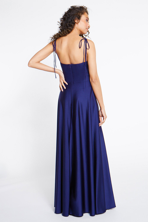 Back view of navy bridesmaid dress with cowl bodice and wrap ball skirt